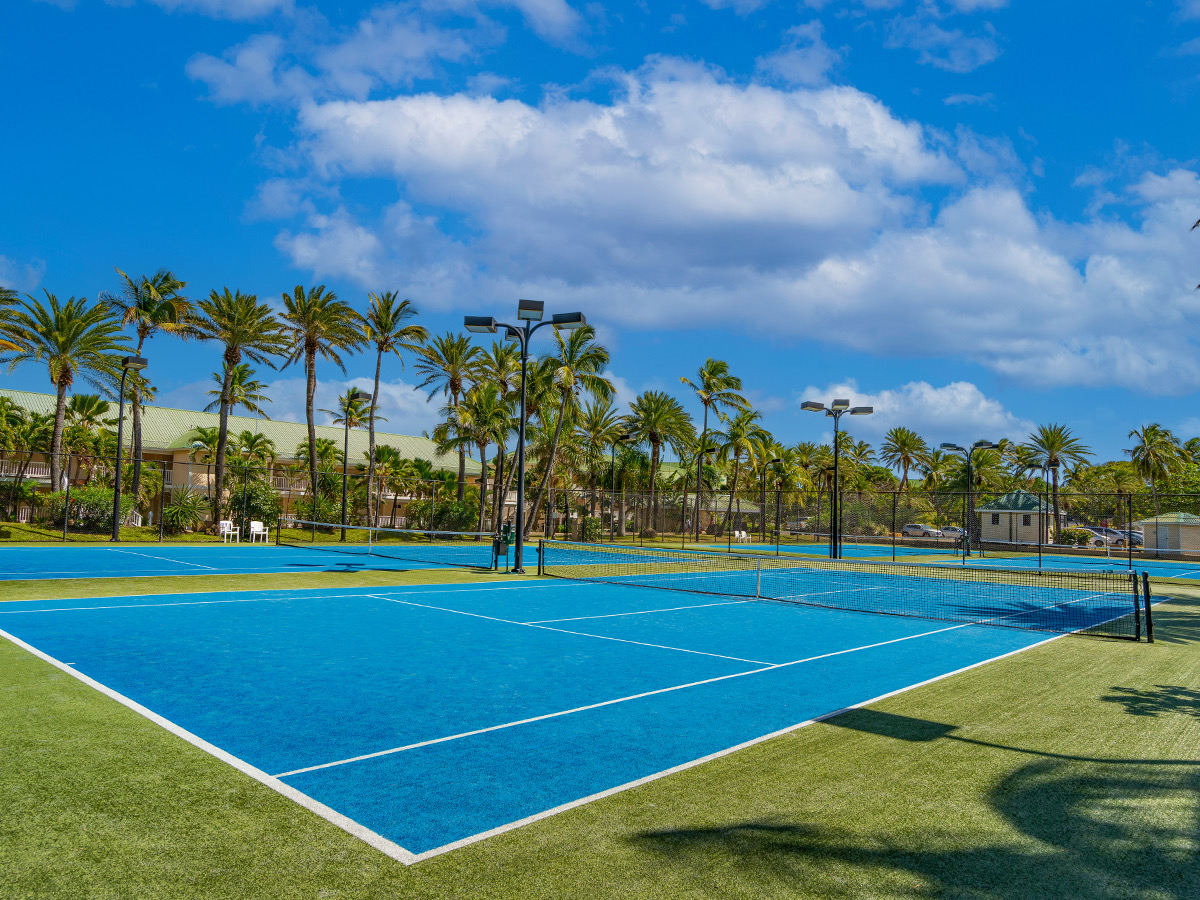 Floodlit tennis courts at St. James&rsquo;s Club & Villas
